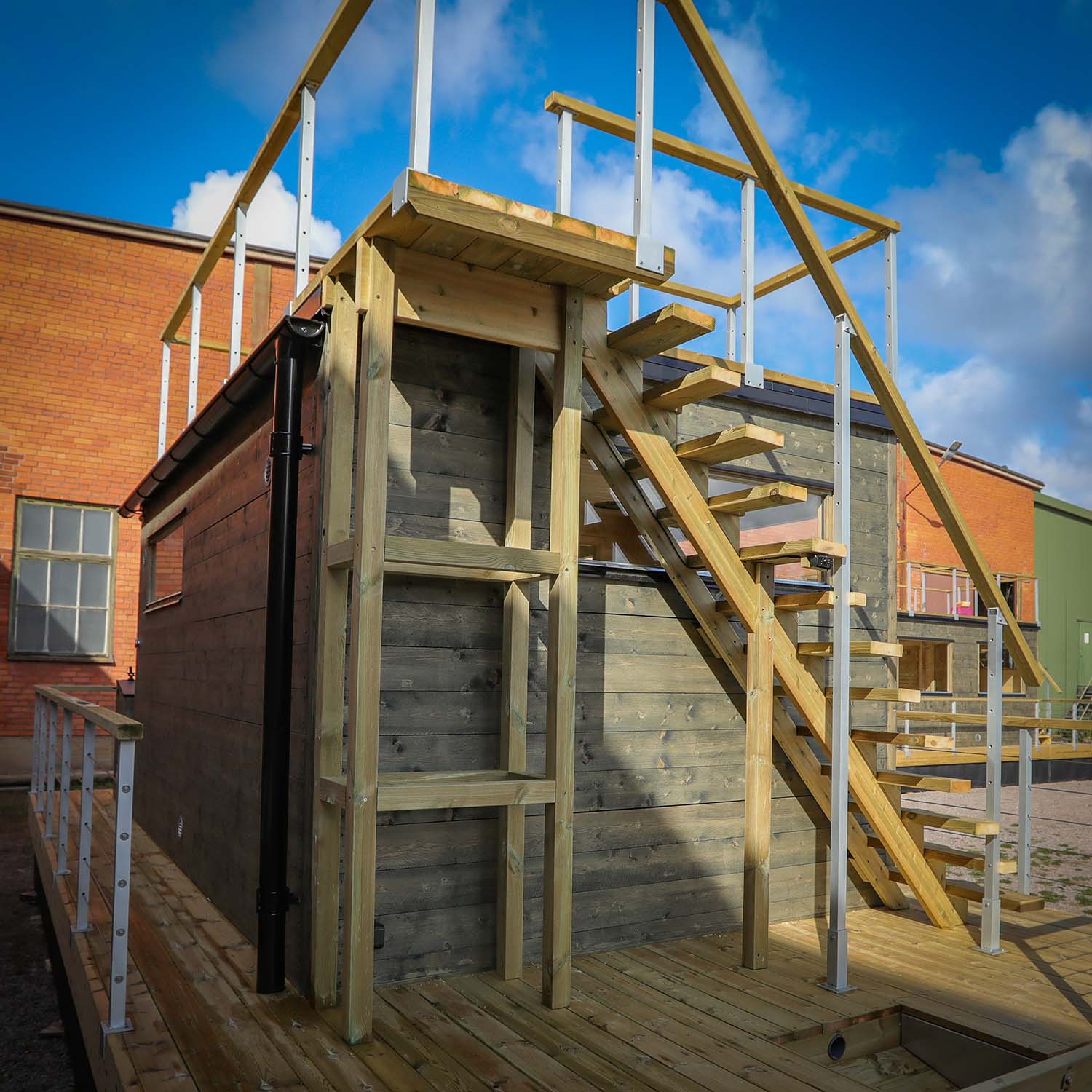 Stairs up to the roof terrace with smart wood storage underneath